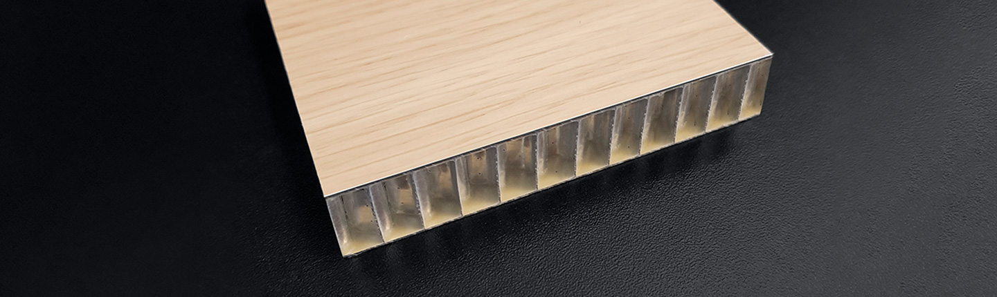Honey comb panel with DOBEL Film laminated Aluminium as top layer.